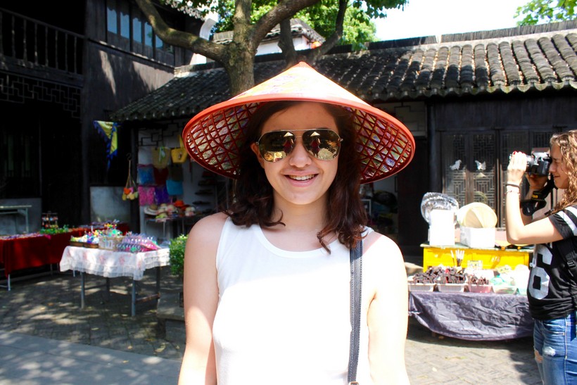 Student wearing an Asian conical hat