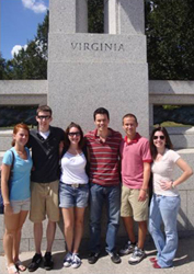 students in front of a virginia pillar