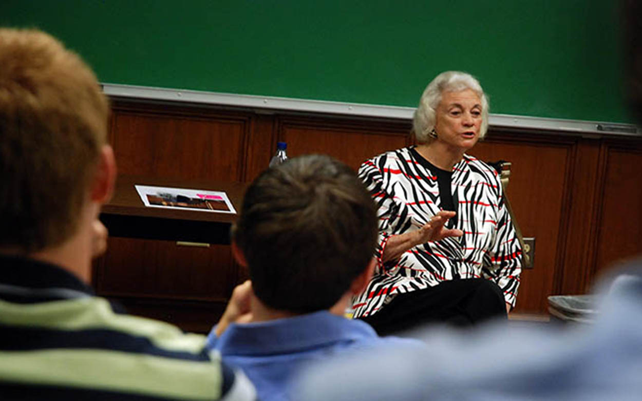 Sandra Day O'Connor speaking in front of a chalkboard