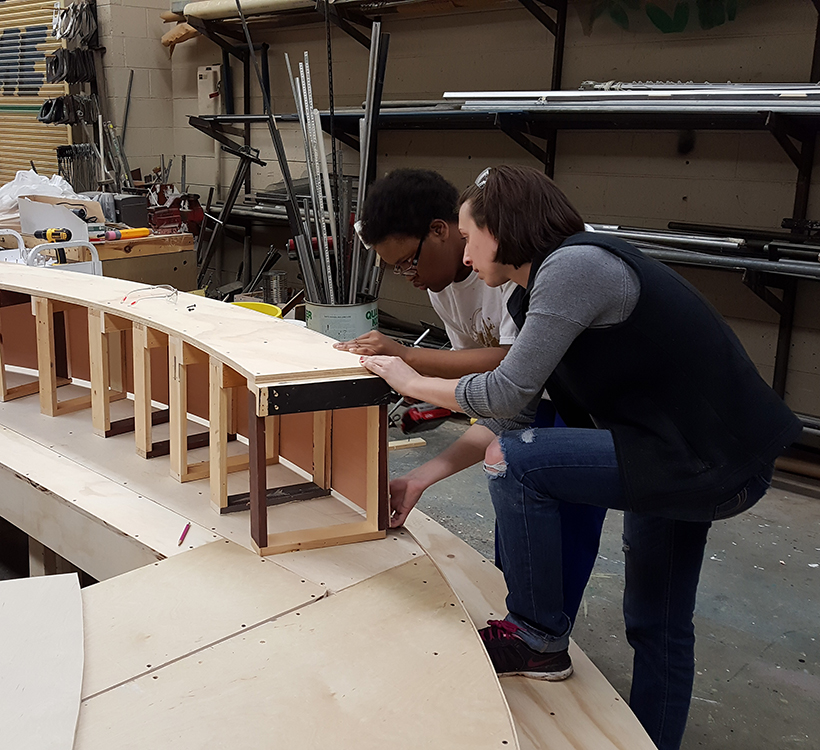 students build wooden set