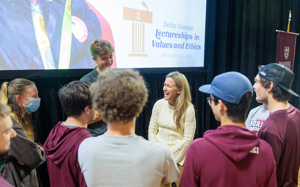 Kristin Armstrong smiles while talking with students after her talk
