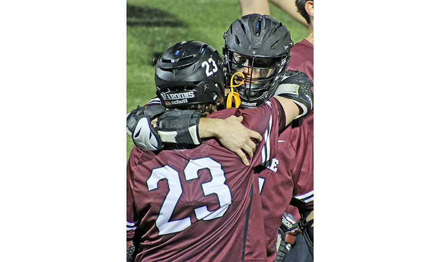 lacrosse players hugging