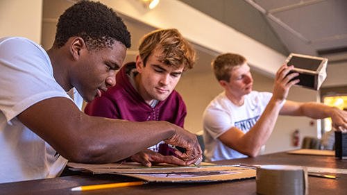 three students in class