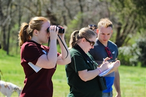 students looking in microscopes