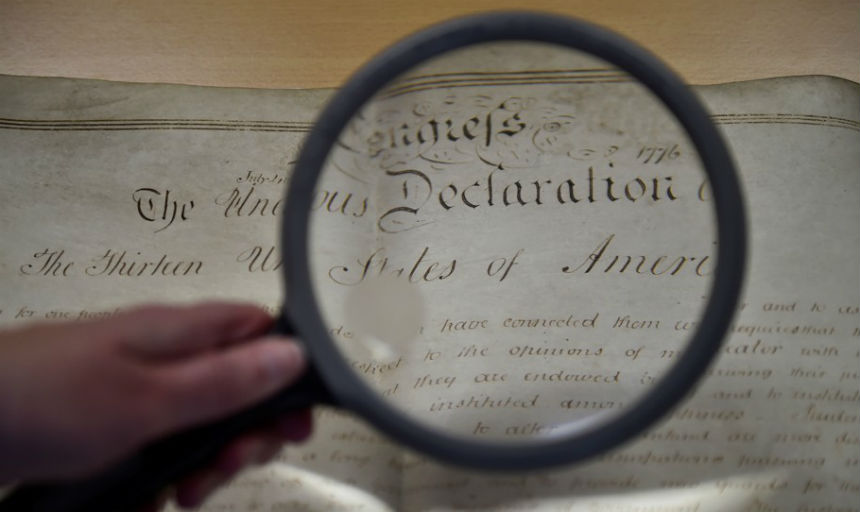 magnifying glass over Declaration of Independence 