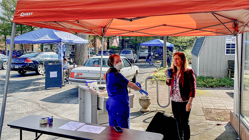 Caitlin Sharkey under a tent during the pandemic