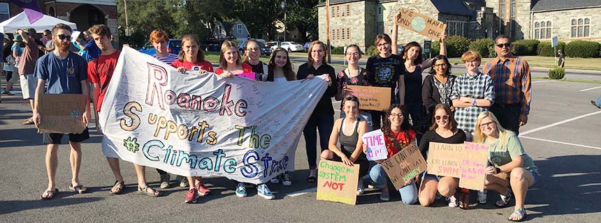 Students holding a banner