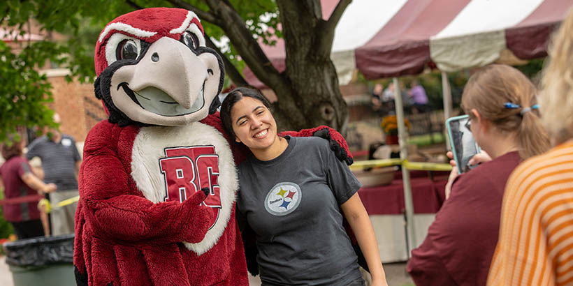 A student taking a photo with Rooney