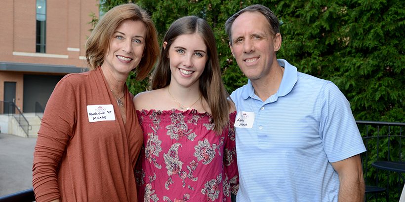 A student with her parents