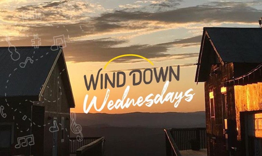 Image of a sunset with buildings and text "Wind Down Wednesdays"