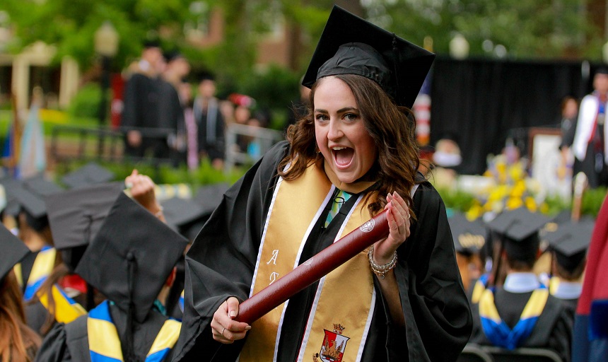 Graduate holding diploma, 2017