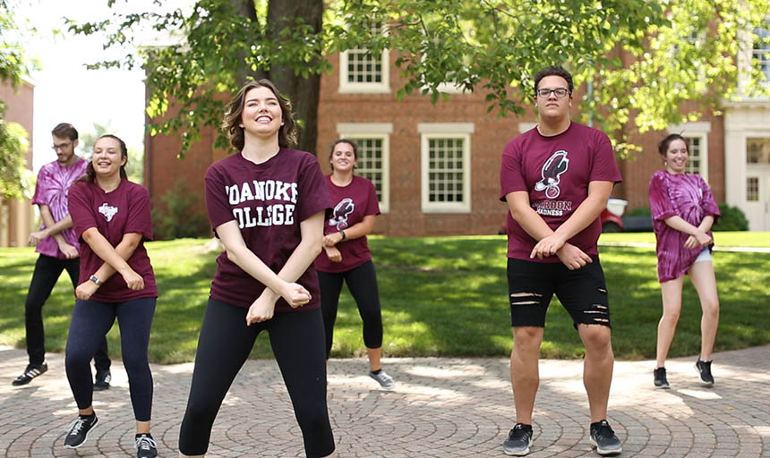 Students smiling and dancing