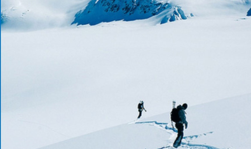 two snowboarers on a snowy mountain