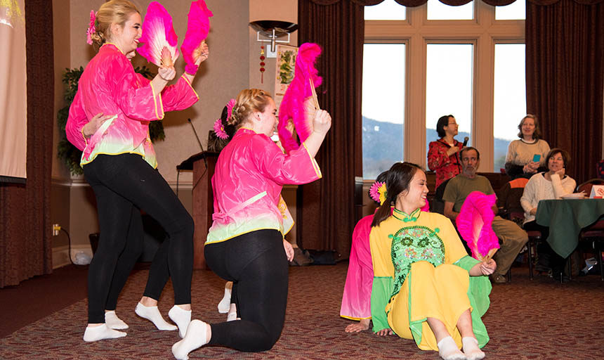 Students dressed up for the lunar new year celebration and dancing