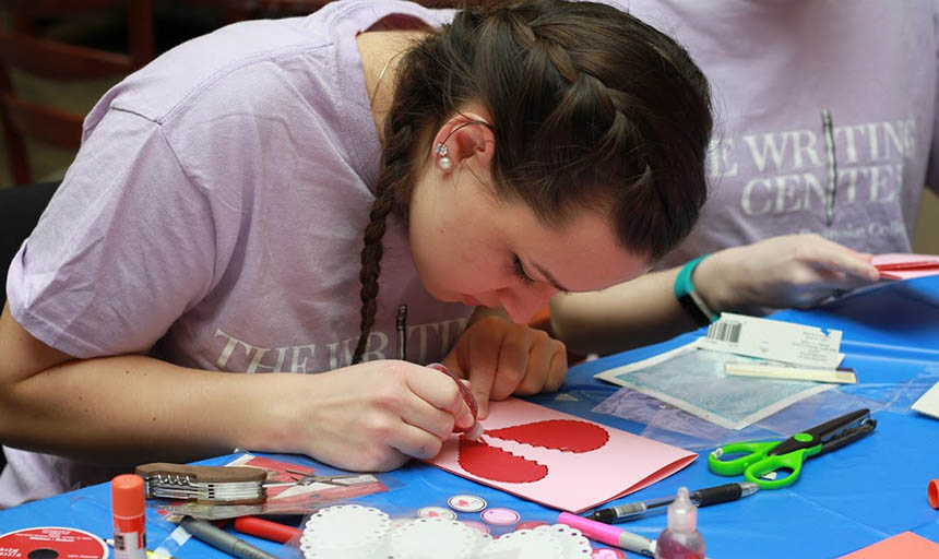 student making their own valentine