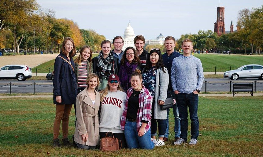 Students standing in front of the capital building