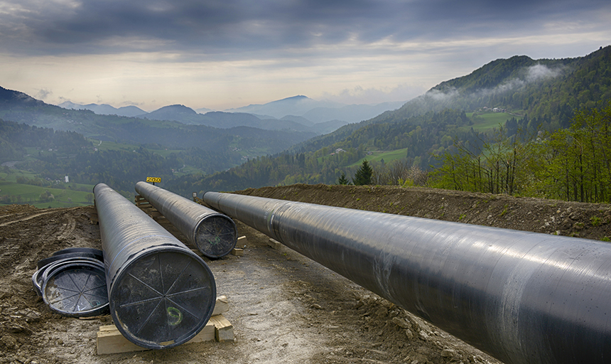 pipeline with mountains in the background