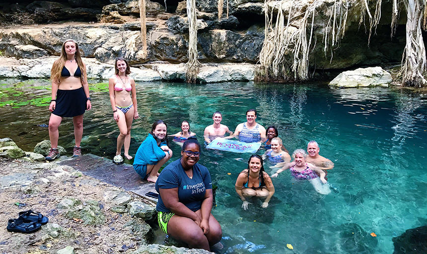 Students in pool of water