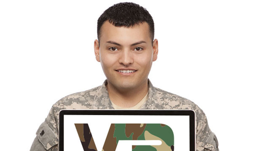 Veteran holding a laptop