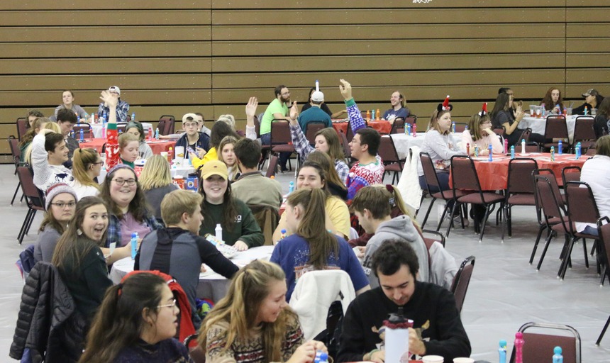 Students at tables playing bingo at a previous event