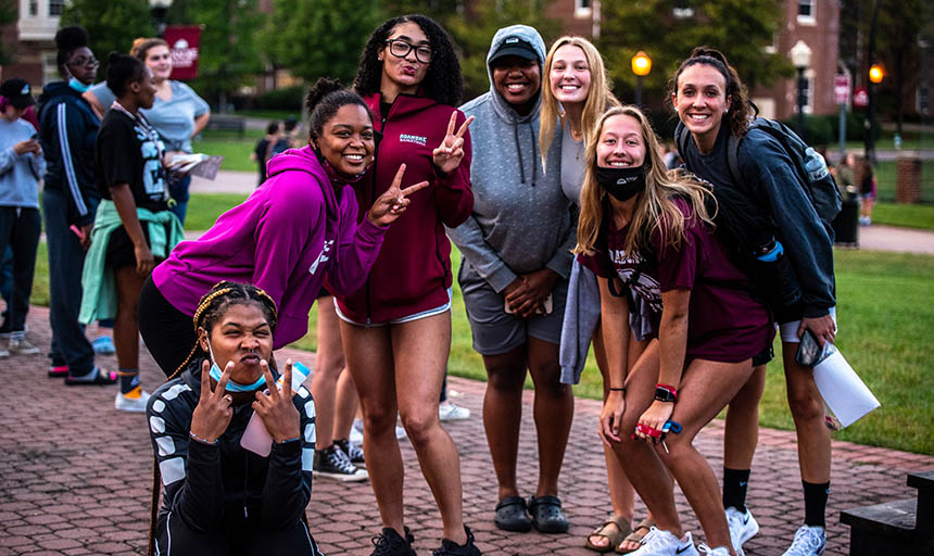 A group of students at Pack the MAQ smiling at the camera