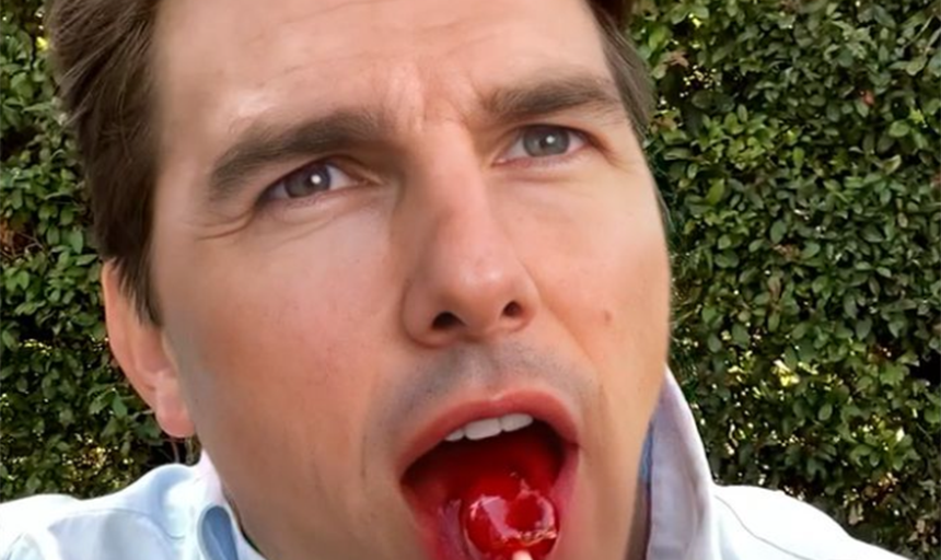 A fake photo of Tom Cruise eating a lollipop