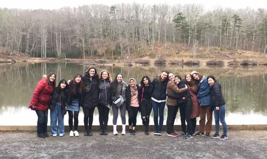 A group of Roanoke College women standing by a river