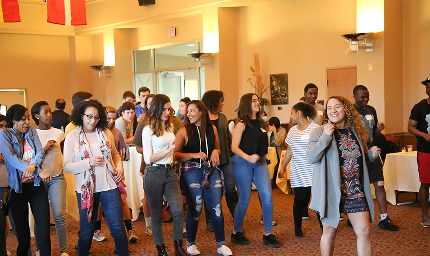 A group of people dancing in the Wortmann Ballroom