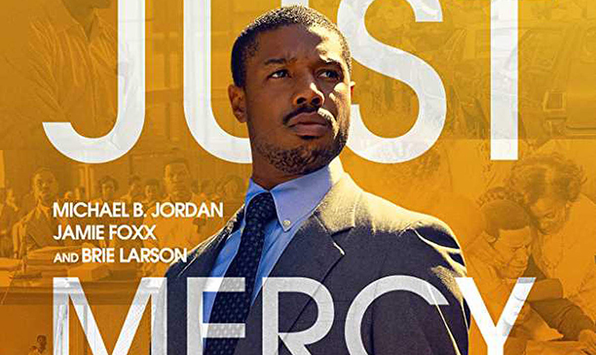 A photo of Michael B Jordan in costume with a background of images from the film. Across the top is the word "Just" and across the bottom is the word "Mercy." On the left, text reads "Michael B. Jordan, Jamie Foxx, and Brie Larson"