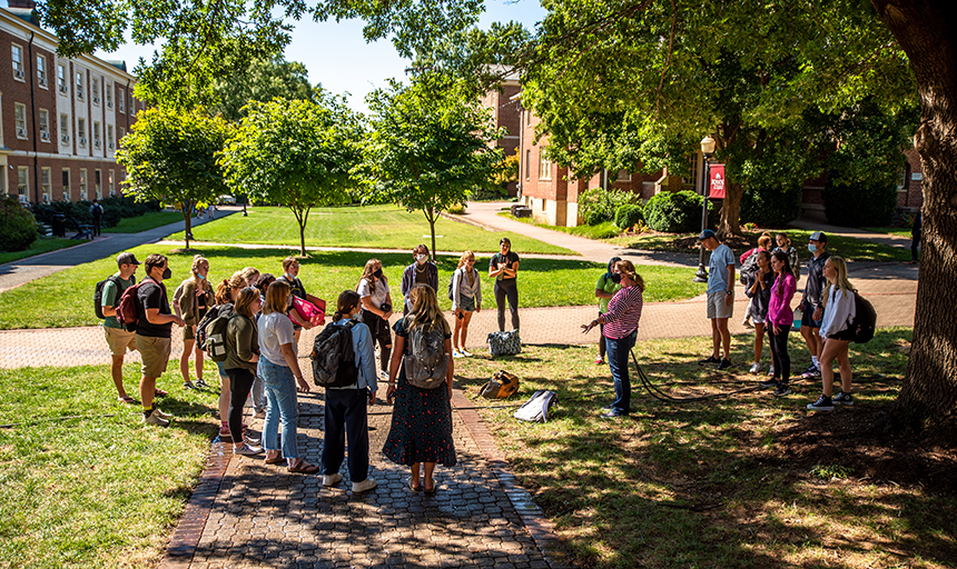 Students standing outside in a group.