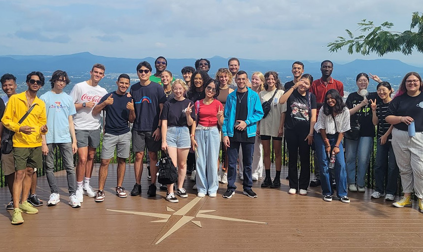 International students smile for a photo during a visit to the Roanoke Star