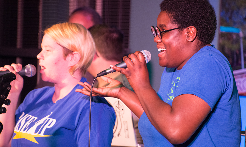 Two people singing 