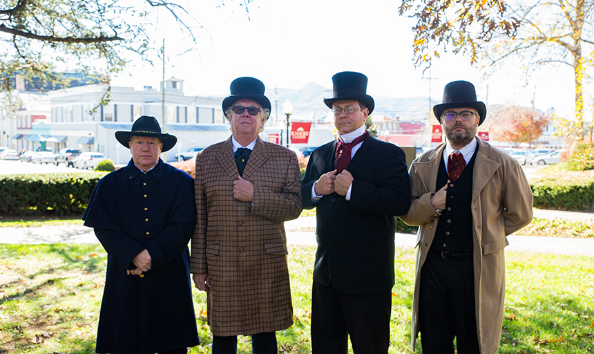 Four men dressed up in period garb