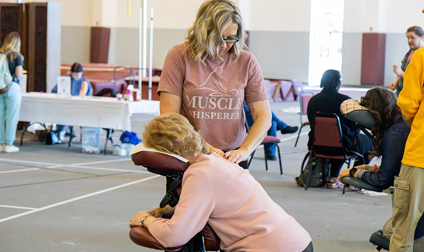 person getting a chair massage