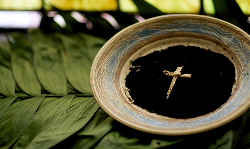 photo of a bowl of ashes with a cross figure 