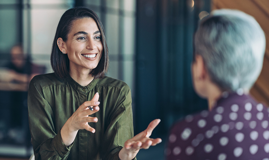 Two business women talking