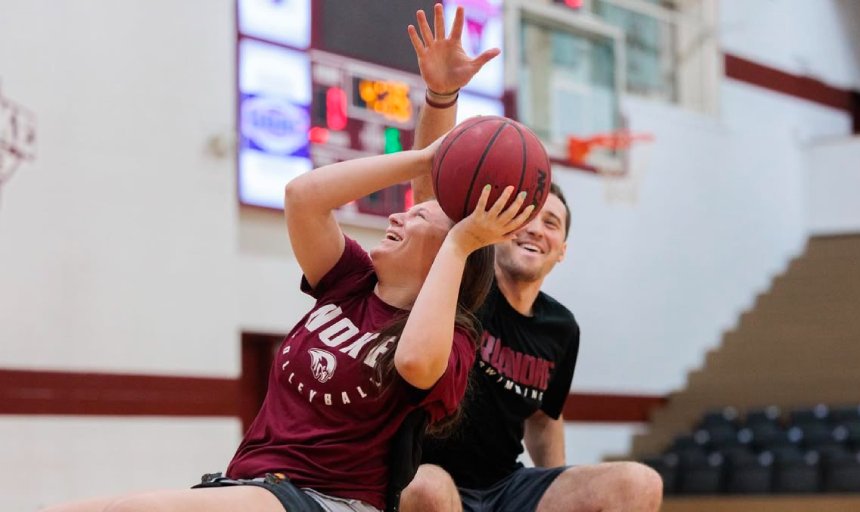 Students playing Wheel chair basket ball 