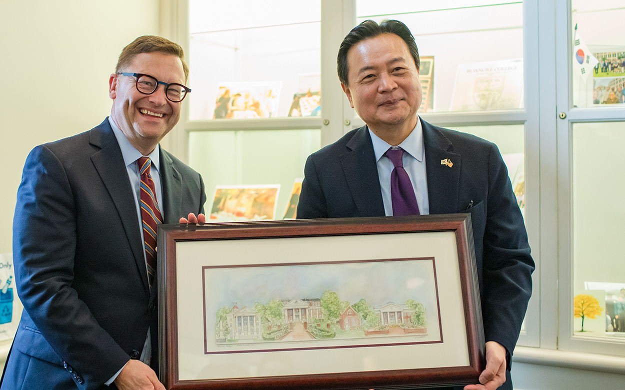 Ambassador Cho and President Shushok hold a framed picture