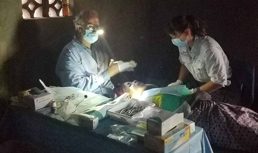 student intern provides medical care to a patient
