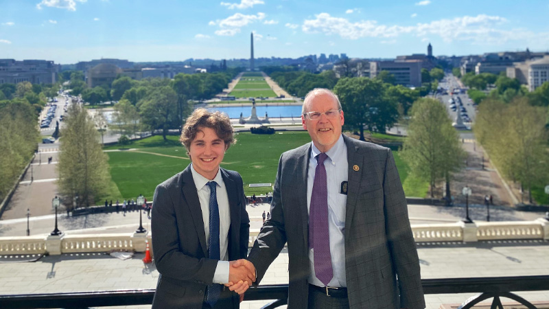 Luke Coburn smiling for a photo with Congressman Morgan Griffith