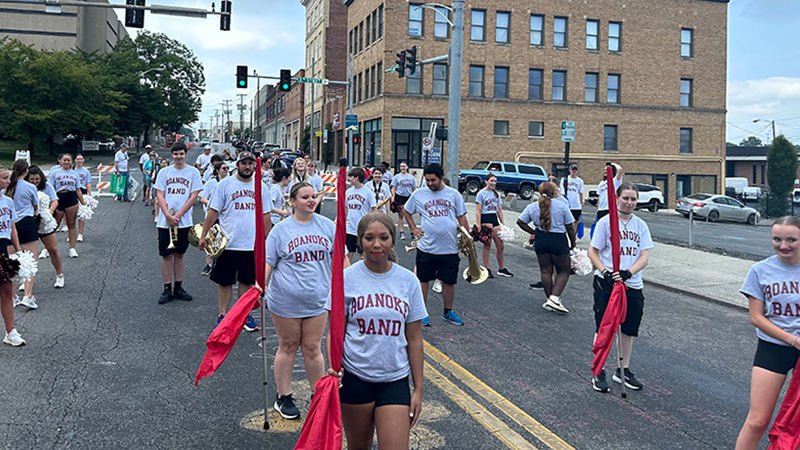 Color guard members and musicians line up in a downtown street for the start of the Roanoke Labor Day Parade