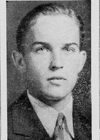 Grainy black-and-white head shot of a young white man with dark hair slicked back. 