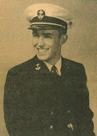 Old yellowed headshot of an extremely dashing Navy man in a dark uniform and white hat.