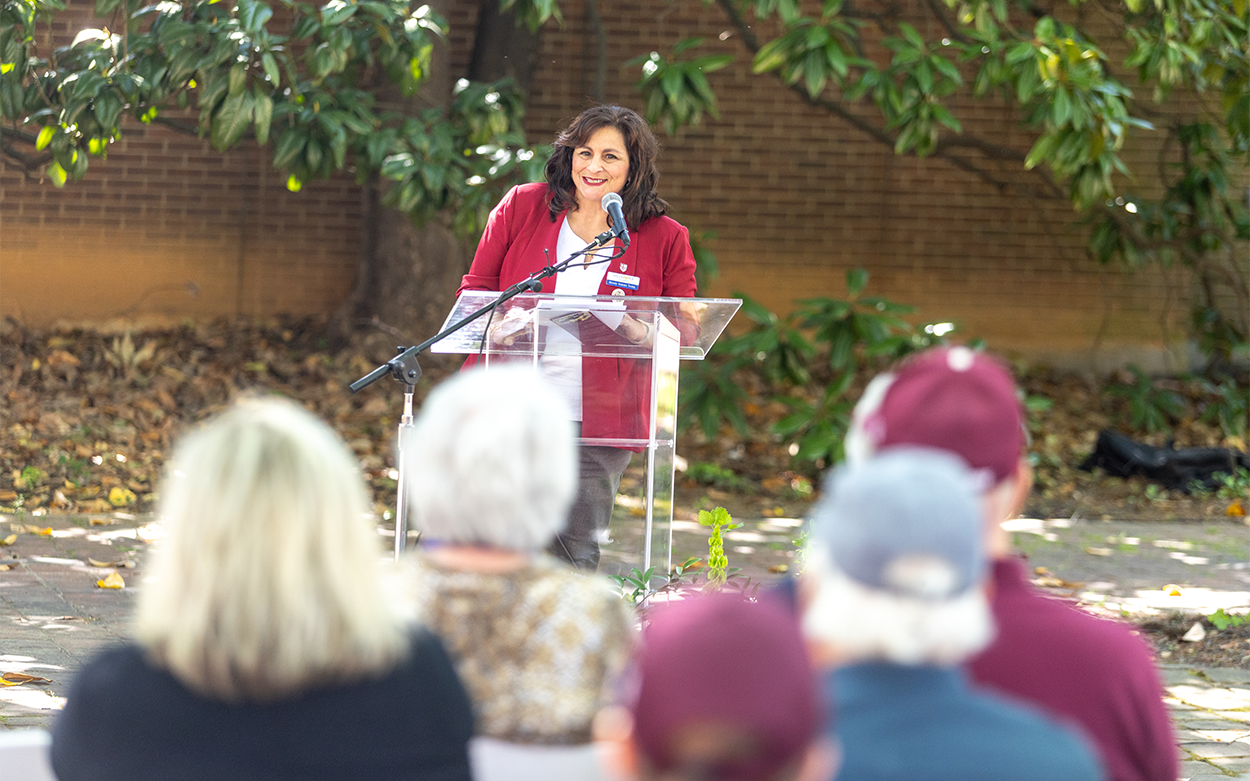 Roanoke College alum and Salem Mayor Renee Turk smiles from the podium while addressing the crowd