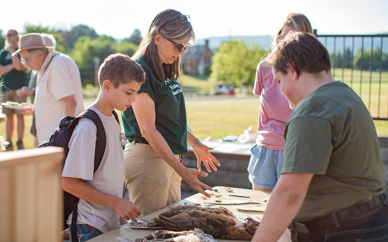 young student speaks to Roanoke student about owls