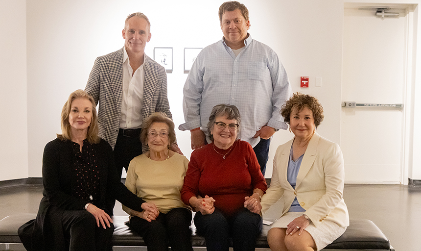 Group photo of four women and two men in an art gallery