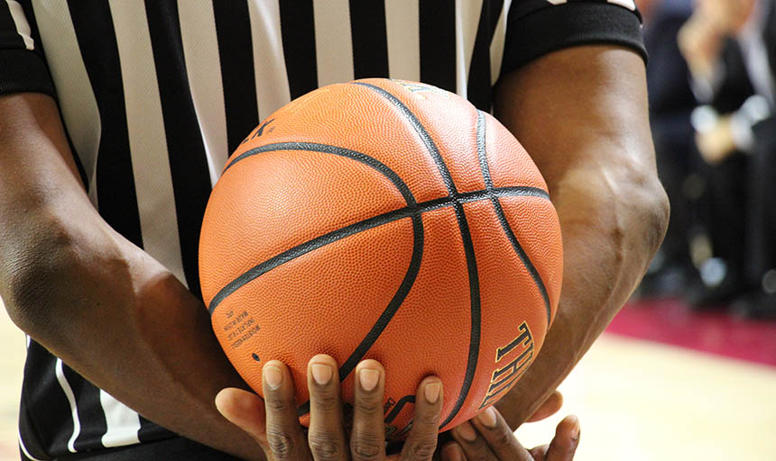 Referee holding basketball