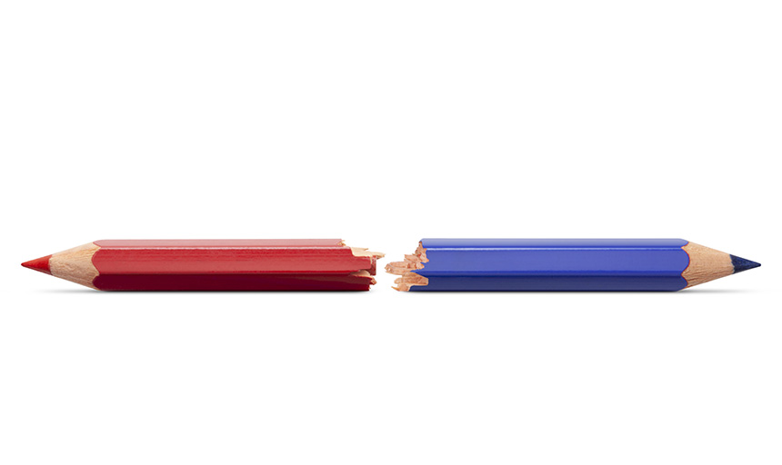 a broken pencil half in red and half in blue