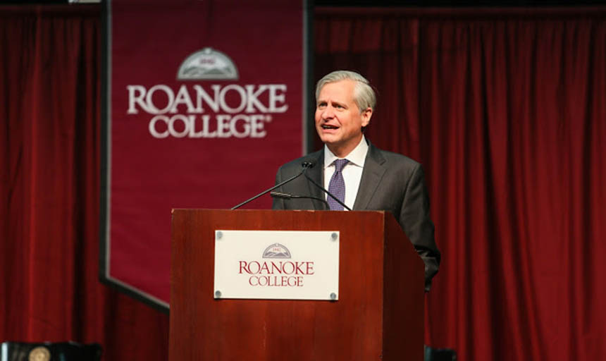 Jon Meacham behind a podium talking to an audience