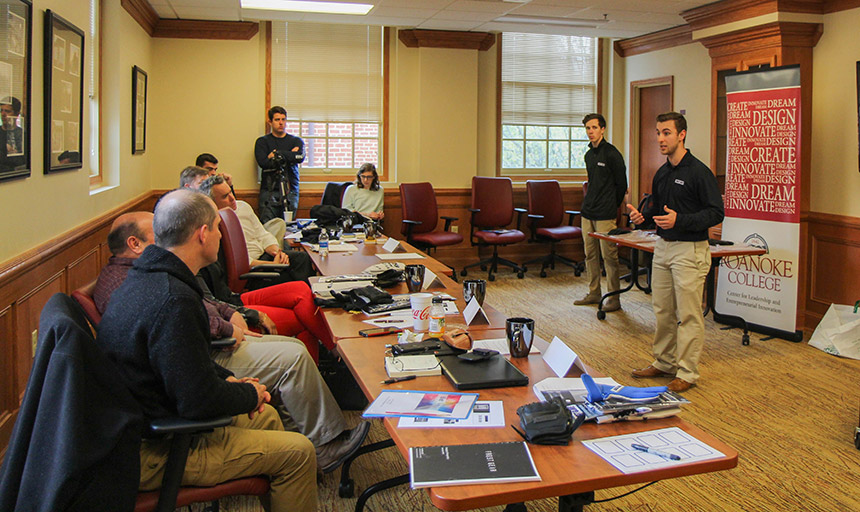 Luke Aprile discusses his Frost Gear business for judges during the Pitch competition.